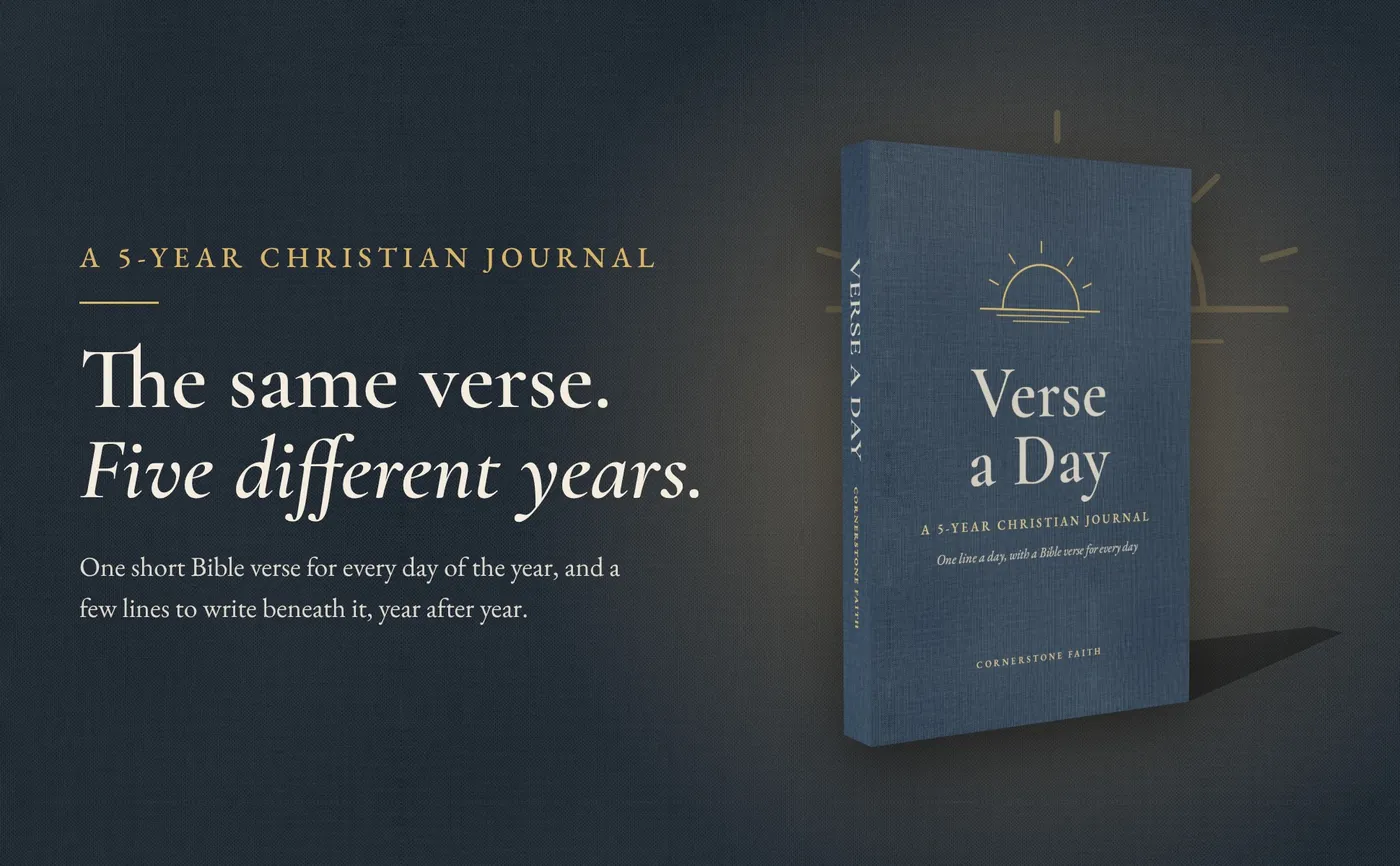 Verse a Day paperback in slate blue linen in warm light beside the line The same verse. Five different years.